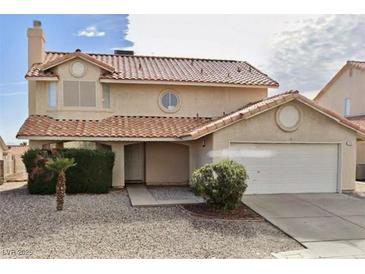 Charming two-story home with desert landscaping and a spacious two-car garage at 2263 Risco Ln, Laughlin, NV 89029