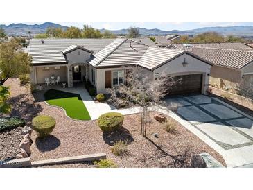 Beautiful single-story home featuring desert landscaping, a tile roof, and a two-car garage at 2921 Hayden Creek Ter, Henderson, NV 89052