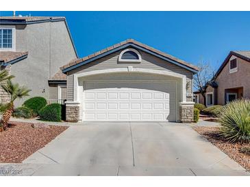 Charming single-story home with a two-car garage and well-maintained landscaping at 420 Blush Creek Pl, Las Vegas, NV 89144