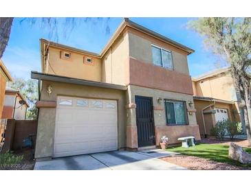 Inviting two-story home featuring a one car garage, desert landscaping, and neutral color scheme at 5229 Starter Ave, Las Vegas, NV 89156