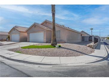 Charming single-story home with low maintenance desert landscaping and a two-car garage at 5541 Ramirez St, North Las Vegas, NV 89031