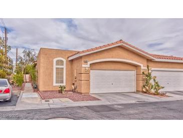 Charming single-story home with desert landscaping and a two-car garage at 9002 Purple Leaf St, Las Vegas, NV 89123