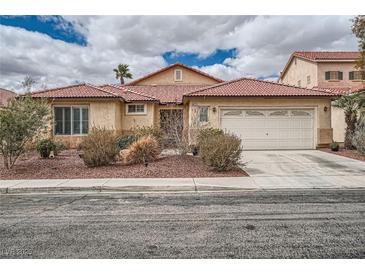 Charming single-story home with a well-maintained front yard and a two-car garage at 9071 Ravenhurst St, Las Vegas, NV 89123