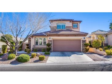 Charming two-story home featuring a well-manicured front yard with lush landscaping at , Las Vegas, NV 89138