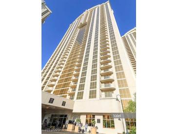 Luxury high-rise condo building with balconies and valet parking for residents and guests at 135 E Harmon Ave # 701, Las Vegas, NV 89109