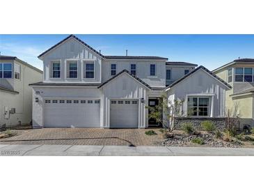 Stunning two-story home showcasing a three-car garage and manicured landscaping at 9007 Antora Summit St, Las Vegas, NV 89166