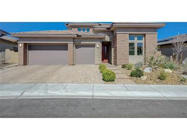 Charming single-Gathering home featuring a multi-car garage and low-maintenance front yard at 12422 Tudor Arch Dr, Las Vegas, NV 89138