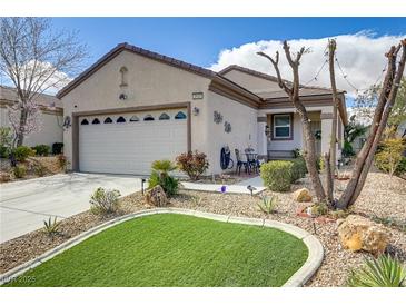 Charming single-story home with manicured landscaping and inviting curb appeal in a sunny setting at 2537 Nashira St, Henderson, NV 89044