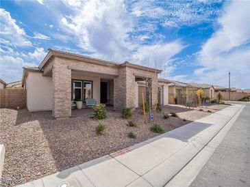 Charming single-story home featuring a neutral color palette and low-maintenance landscaping at 3503 Luca Point Ave, Henderson, NV 89044