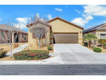 Inviting single-story home featuring a two-car garage and low maintenance landscaping at 4340 Hatch Bend Ave, North Las Vegas, NV 89031