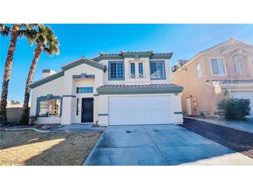 Charming two-story home with stucco exterior, well-maintained landscaping, and two-car garage at 7244 Buglehorn St, Las Vegas, NV 89131