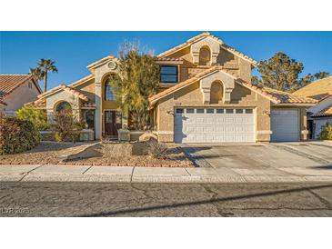 Charming two-story home featuring a neutral stucco finish, tile roof, and a well-manicured front yard at 9532 Cliff View Way, Las Vegas, NV 89117