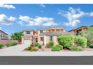 Inviting two-story home with a well-manicured front yard and attached garage at 2212 Barton Mill Ct, North Las Vegas, NV 89084
