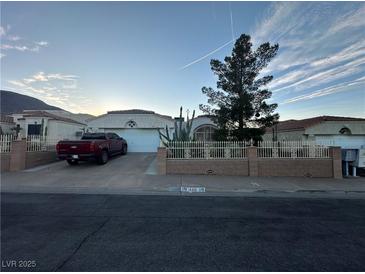 Charming single-Gathering home featuring desert landscaping and a well-maintained front yard at 446 Tiger Lily Way, Henderson, NV 89015