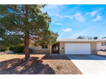 Inviting single-story home featuring a well-maintained front yard and a convenient two-car garage at 7817 Aplin Ave, Las Vegas, NV 89145