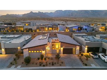 Stunning desert home with modern design, professional landscaping, mountain views, and ample parking at 803 Bolide St, Las Vegas, NV 89138