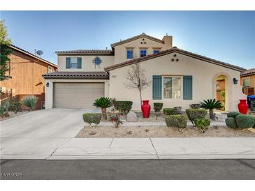 Charming two-story home with well-manicured landscaping and a spacious two-car garage at 1883 Nature Park Dr, North Las Vegas, NV 89084