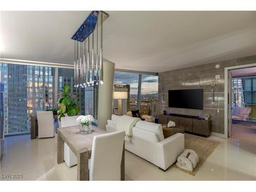 Modern living room with dining area, offering city views from large windows and contemporary decor at 3722 Las Vegas Blvd # 1712, Las Vegas, NV 89158