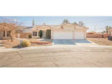 Charming single-story home featuring a two-car garage and low maintenance desert landscaping at 4016 Fairport Dr, North Las Vegas, NV 89032