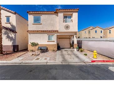 Charming two-story home with desert landscaping, a front bench, and a one-car garage, all under a clear blue sky at 4786 Valleyside Ave, Las Vegas, NV 89115