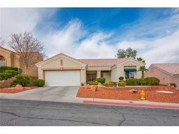 Charming single-story home featuring a two-car garage and well-maintained landscaping at 10320 Bent Brook Pl, Las Vegas, NV 89134