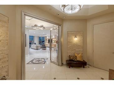 Elegant entryway features marble floors, decorative rug and an open living space with lots of natural light at 2747 Paradise Rd # Ph 3604, Las Vegas, NV 89109
