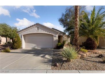 Charming single-story home with a two-car garage and desert landscaping at 502 Edgefield Ridge Pl, Henderson, NV 89012