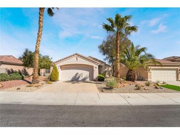 Charming single story home with mature landscaping and a two car garage at 502 Edgefield Ridge Pl, Henderson, NV 89012