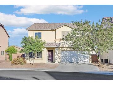 Charming two-story home with a well-maintained lawn and a two-car garage at 8112 Mustang Hill Ct, Las Vegas, NV 89131