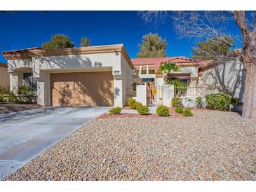 Charming single-story home with a well-manicured yard, two car garage and inviting curb appeal at 8916 Evening Star Dr, Las Vegas, NV 89134