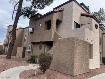 Charming condo featuring a stucco facade, terracotta roof, and private entryway at , Las Vegas, NV 89142