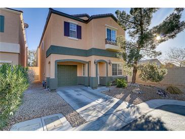 Two-story home showcasing charming curb appeal, a well-manicured front yard, and an attached one car garage at 11103 African Sunset St, Henderson, NV 89052