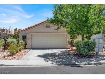 Charming one-story home with a desert landscape and covered front entrance at 2137 Hidden Ranch Ter, Henderson, NV 89052