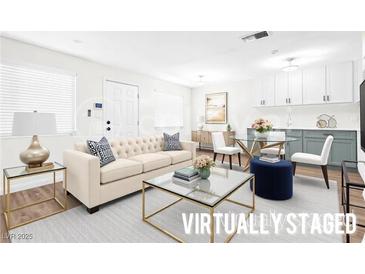 Bright living room featuring a stylish sofa, glass coffee table, and modern decor at 304 Orland St # 43, Las Vegas, NV 89107