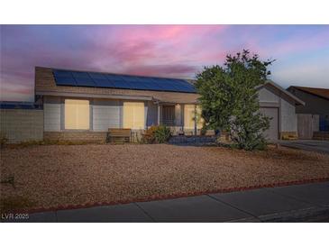 Cozy single-story home featuring desert landscaping and solar panels for energy efficiency at 53 Montello Ave, Las Vegas, NV 89110