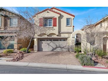 Charming two-story home showcasing a well-maintained front yard and a two-car garage at 10556 Nantucket Ridge Ave, Las Vegas, NV 89166