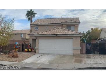 Charming two-story home featuring a two car garage and desert landscaping at 1071 Nordyke Ave, Henderson, NV 89015