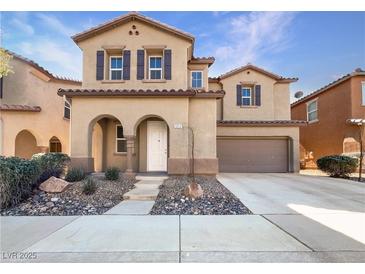 Charming two-story home with desert landscaping and a two-car garage at 7211 Hickory Post Ave, Las Vegas, NV 89179