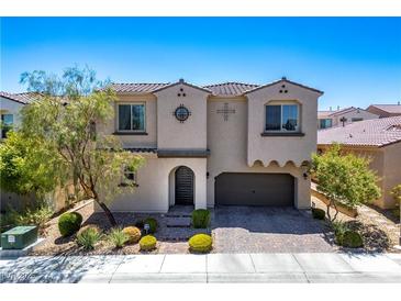 Charming two-story home featuring a well-manicured front yard and a two-car garage at 9643 Ponderosa Skye Ct, Las Vegas, NV 89166