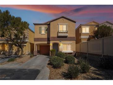 Charming two-story home featuring a well-maintained front yard and an attached garage at 11094 Arcadia Sunrise Dr, Henderson, NV 89052