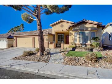 Charming single-story home featuring a well-manicured yard and a welcoming two-car garage at 2714 Thomasville Ave, Henderson, NV 89052