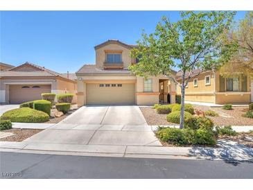 Charming two-story home featuring a well-manicured front yard and a spacious two-car garage at 3645 Bella Legato Ave, North Las Vegas, NV 89081