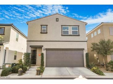 Charming two-story home featuring a well-manicured front yard and a two-car garage at 3681 Via Sonja Ave, Las Vegas, NV 89115