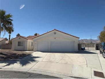 Charming single-story home with two-car garage and well-maintained landscaping at 7133 Tropical Island Cir, Las Vegas, NV 89129