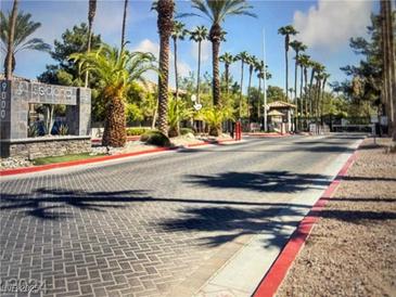 Gated community entrance featuring beautiful trees and landscaping at 9000 Las Vegas Blvd # 1029, Las Vegas, NV 89123