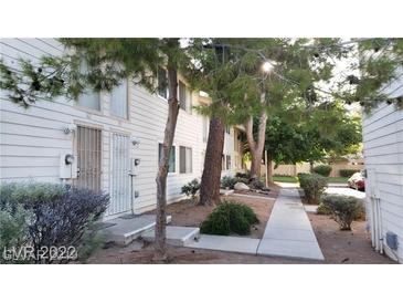 Inviting two-story townhouse with well-maintained landscaping and a walkway to the entrance at 4770 Topaz St # 79, Las Vegas, NV 89121