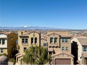 Beautiful multi-story houses with red tile roofs in a desirable location with scenic mountain views at 384 Gracious Way, Henderson, NV 89011