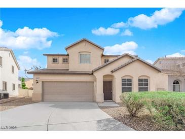 Charming two-story home with a well-manicured front yard and inviting entrance at 5124 Veeder Crest St, North Las Vegas, NV 89081