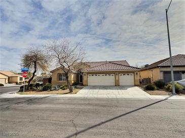 Charming single-story home featuring a three-car garage and well-maintained landscaping at 3581 Rio Paloma Ct, North Las Vegas, NV 89031
