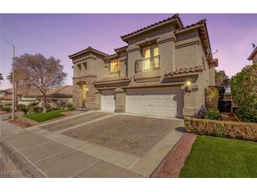 Two-story home featuring a three-car garage, neutral color palette, and charming architectural details at 1436 Via Merano St, Henderson, NV 89052